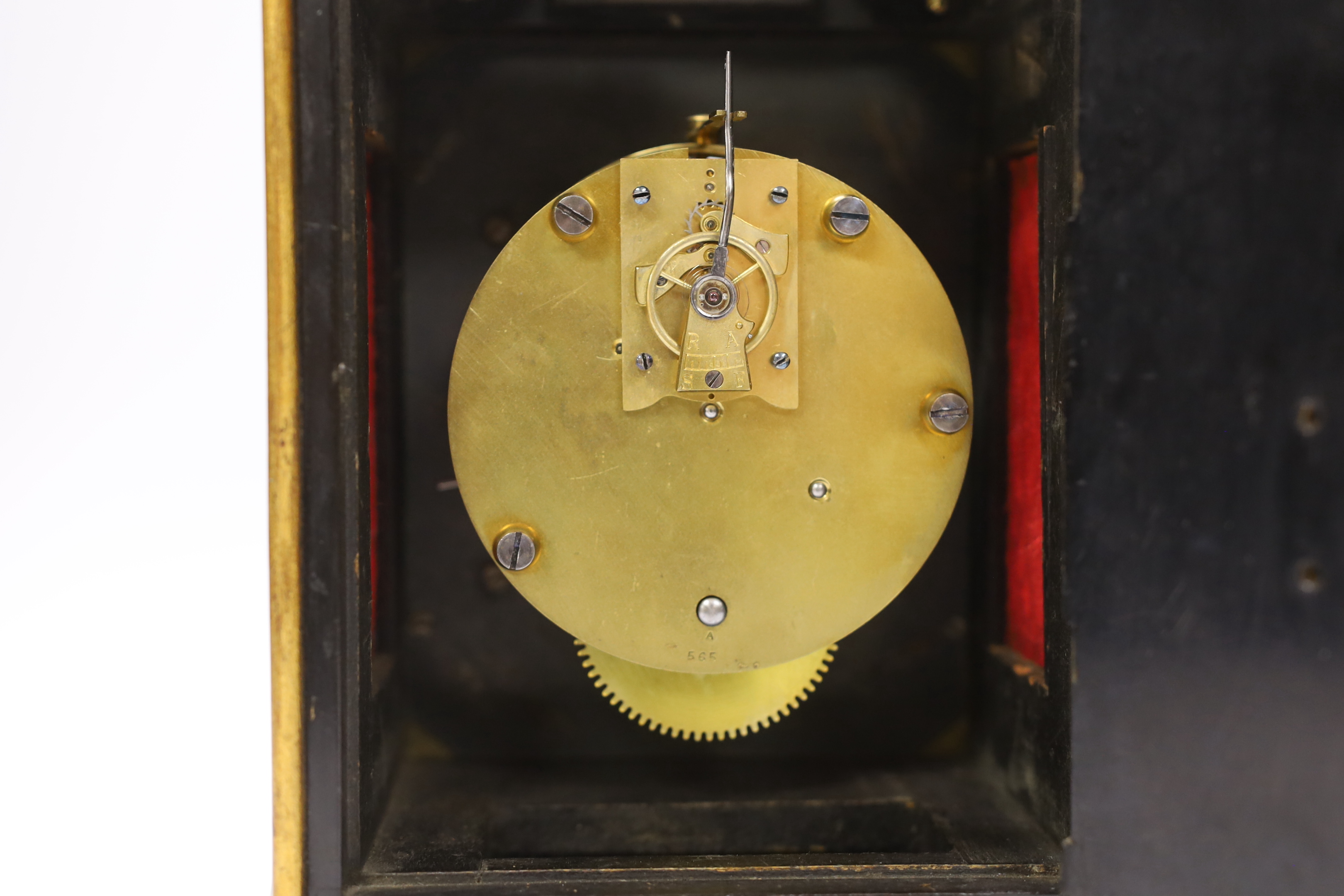 A French ebonised mantel timepiece with silvered dial with balance escapement, 28cm high